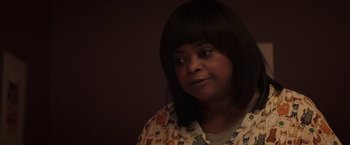 Movie still from “Ma” (2019), directed by Tate Taylor – A person wearing a shirt with cats on it; Close Up shot, High angle