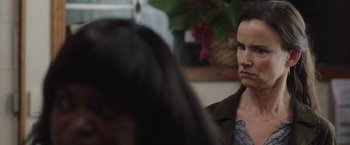 Movie still from “Ma” (2019), directed by Tate Taylor – A woman sitting in front of another woman in a room; Close Up shot, Over the shoulder angle