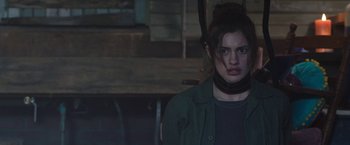 Movie still from “Ma” (2019), directed by Tate Taylor – A young woman with a collar around her neck; Close Up shot, Over the shoulder angle