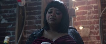 Movie still from “Ma” (2019), directed by Tate Taylor – A woman in a red dress and a black jacket; Close Up shot, High angle