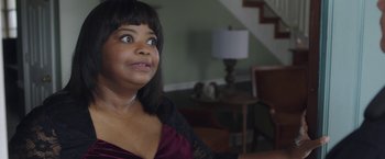 Movie still from “Ma” (2019), directed by Tate Taylor – A person sitting in a room; Close Up shot, Over the shoulder angle