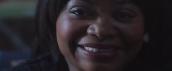 Movie still from “Ma” (2019), directed by Tate Taylor – A woman's face with white teeth; Extreme Close Up shot, Over the shoulder angle
