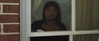 Movie still from “Ma” (2019), directed by Tate Taylor – A woman looking out of a window at the camera; Close Up shot, Over the shoulder angle