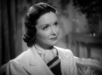 Movie still from “Mad About Music” (1938), directed by Norman Taurog – An old photo of a woman wearing a suit and tie; Close Up shot, High angle