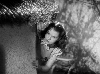 Movie still from “Mad About Music” (1938), directed by Norman Taurog – A woman holding an umbrella over her head; Close Up shot, Low angle