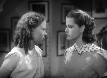 Movie still from “Mad About Music” (1938), directed by Norman Taurog – Two young girls are facing each other in a room; Close Up shot, High angle
