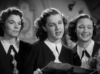 Movie still from “Mad About Music” (1938), directed by Norman Taurog – A group of young women standing next to each other; Medium shot, Low angle
