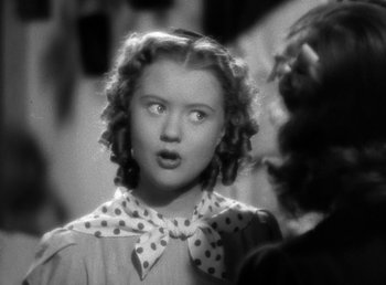 Movie still from “Mad About Music” (1938), directed by Norman Taurog – A young girl with a surprised look on her face; Close Up shot, High angle