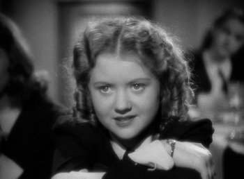 Movie still from “Mad About Music” (1938), directed by Norman Taurog – A black and white photo of a young girl; Close Up shot, High angle