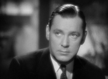 Movie still from “Mad About Music” (1938), directed by Norman Taurog – An older man in a suit and tie; Close Up shot, Low angle