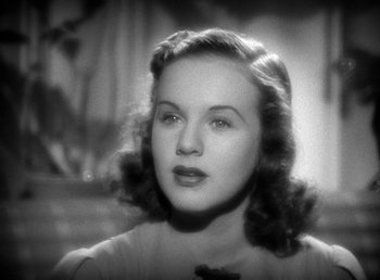 Movie still from “Mad About Music” (1938), directed by Norman Taurog – An old black and white photo of a woman; Close Up shot, High angle