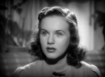 Movie still from “Mad About Music” (1938), directed by Norman Taurog – An old black and white photo of a young woman; Close Up shot, High angle