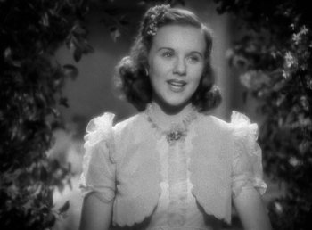 Movie still from “Mad About Music” (1938), directed by Norman Taurog – An old black and white photo of a young woman; Close Up shot, High angle