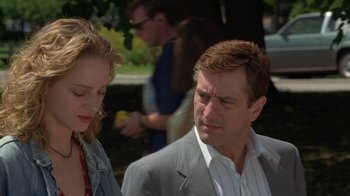 Movie still from “Mad Dog and Glory” (1993), directed by John McNaughton – A man and a woman standing next to each other outside; Close Up shot, Over the shoulder angle