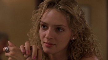 Movie still from “Mad Dog and Glory” (1993), directed by John McNaughton – A person with curly blonde hair; Close Up shot, Low angle