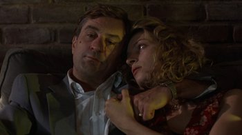 Movie still from “Mad Dog and Glory” (1993), directed by John McNaughton – A man and a woman embracing each other in the dark; Close Up shot, Low angle