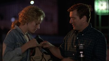 Movie still from “Mad Dog and Glory” (1993), directed by John McNaughton – A man and a woman looking at each other; Medium shot, Over the shoulder angle