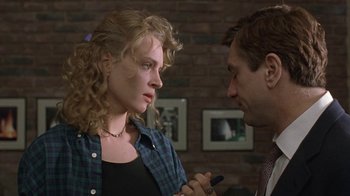 Movie still from “Mad Dog and Glory” (1993), directed by John McNaughton – A man and a woman talking to each other; Close Up shot, Over the shoulder angle