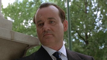 Movie still from “Mad Dog and Glory” (1993), directed by John McNaughton – A person wearing a suit and tie; Close Up shot, Low angle