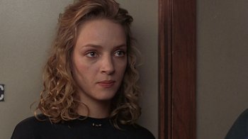 Movie still from “Mad Dog and Glory” (1993), directed by John McNaughton – A person with curly hair; Close Up shot, Over the shoulder angle