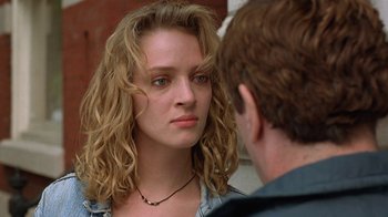 Movie still from “Mad Dog and Glory” (1993), directed by John McNaughton – A young woman looking at a young man; Close Up shot, Over the shoulder angle