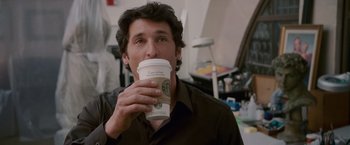 Movie still from “Made of Honor” (2008), directed by Paul Weiland – A man drinking a cup of coffee from a starbucks cup; Close Up shot, Over the shoulder angle