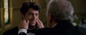 Movie still from “Made of Honor” (2008), directed by Paul Weiland – A man in a tuxedo looking at another man in a suit; Close Up shot, Over the shoulder angle