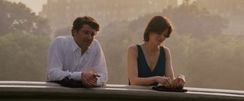 Movie still from “Made of Honor” (2008), directed by Paul Weiland – A man and a woman sitting next to each other at a table; Medium shot, Over the shoulder angle