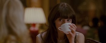 Movie still from “Made of Honor” (2008), directed by Paul Weiland – A woman is drinking a cup of coffee; Close Up shot, Over the shoulder angle
