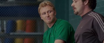 Movie still from “Made of Honor” (2008), directed by Paul Weiland – A person wearing a green shirt; Close Up shot, Over the shoulder angle