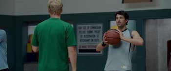 Movie still from “Made of Honor” (2008), directed by Paul Weiland – Two young men are playing a game of basketball; Medium shot, Over the shoulder angle