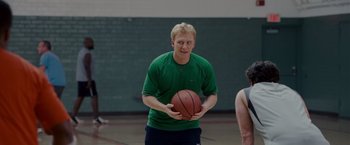 Movie still from “Made of Honor” (2008), directed by Paul Weiland – A man holding a basketball in his hands; Medium shot, Over the shoulder angle