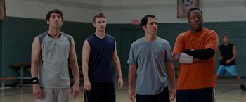 Movie still from “Made of Honor” (2008), directed by Paul Weiland – A group of young men standing in a gym; Medium shot, Over the shoulder angle