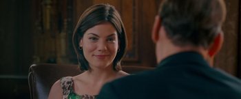 Movie still from “Made of Honor” (2008), directed by Paul Weiland – A woman smiles at a man in a suit; Close Up shot, Over the shoulder angle