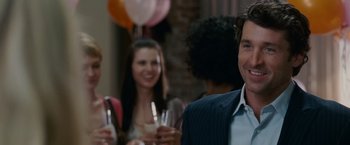 Movie still from “Made of Honor” (2008), directed by Paul Weiland – A group of people standing around a room with wine glasses; Close Up shot, Over the shoulder angle