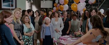 Movie still from “Made of Honor” (2008), directed by Paul Weiland – A group of women standing next to each other in a room; Wide shot, Over the shoulder angle