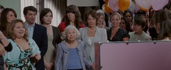 Movie still from “Made of Honor” (2008), directed by Paul Weiland – A group of women standing next to each other in a room; Medium shot, Over the shoulder angle