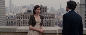 Movie still from “Made of Honor” (2008), directed by Paul Weiland – A woman standing on a ledge in front of a city skyline; Medium shot, Over the shoulder angle