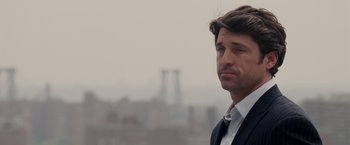 Movie still from “Made of Honor” (2008), directed by Paul Weiland – A man in a suit and tie; Close Up shot, Over the shoulder angle
