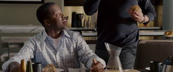 Movie still from “Made of Honor” (2008), directed by Paul Weiland – A man sitting at a dinner table shaking hands with a woman; Close Up shot, Over the shoulder angle