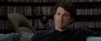 Movie still from “Made of Honor” (2008), directed by Paul Weiland – A man sitting in front of a book shelf; Close Up shot, Over the shoulder angle