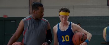 Movie still from “Made of Honor” (2008), directed by Paul Weiland – Two men standing next to each other on a basketball court; Medium shot, Over the shoulder angle
