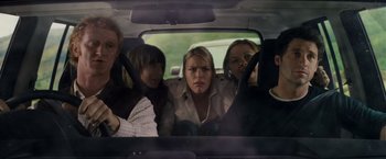 Movie still from “Made of Honor” (2008), directed by Paul Weiland – A group of people sitting in the back of a car; Medium shot, Over the shoulder angle