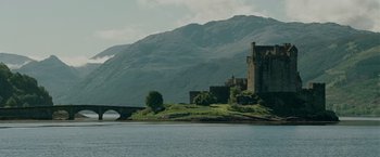 Movie still from “Made of Honor” (2008), directed by Paul Weiland – A castle sits on a hill overlooking a lake; Extreme Wide shot, Low angle