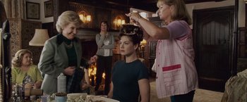 Movie still from “Made of Honor” (2008), directed by Paul Weiland – A group of women standing around a table with food; Medium shot, Over the shoulder angle