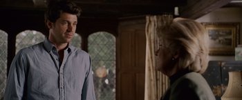 Movie still from “Made of Honor” (2008), directed by Paul Weiland – A man and a woman standing next to each other in a room; Medium shot, Over the shoulder angle