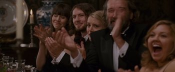 Movie still from “Made of Honor” (2008), directed by Paul Weiland – A group of people clapping at a party; Close Up shot, Over the shoulder angle