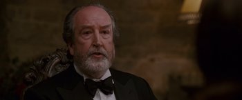 Movie still from “Made of Honor” (2008), directed by Paul Weiland – An older man with a beard wearing a tuxedo; Close Up shot, High angle