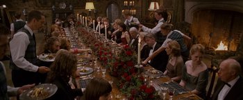 Movie still from “Made of Honor” (2008), directed by Paul Weiland – A large long table with people sitting at it; Wide shot, High angle