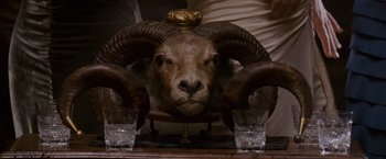 Movie still from “Made of Honor” (2008), directed by Paul Weiland – An animal head sitting on top of a table; Close Up shot, Overhead angle